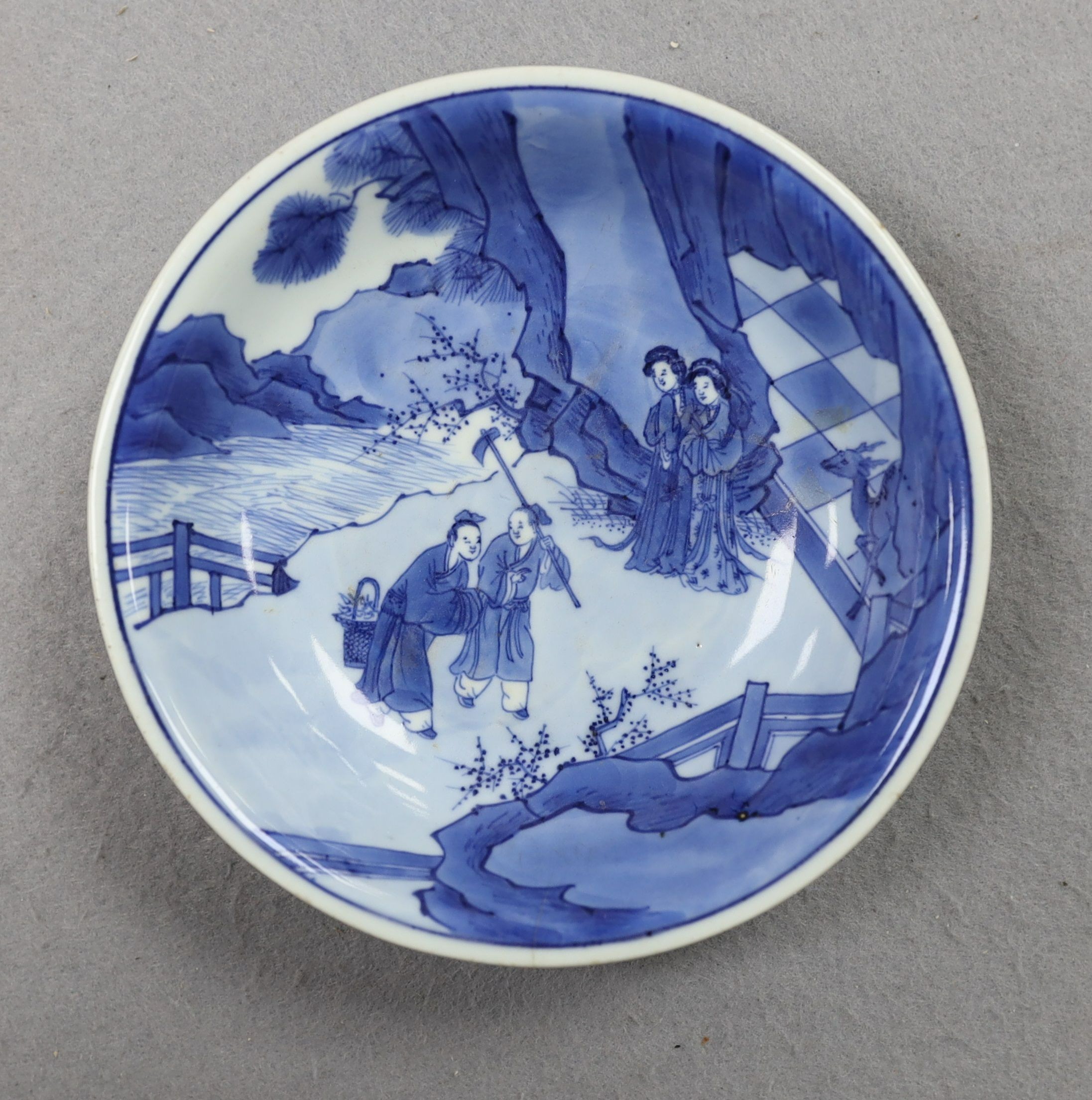 NB BOTH WITH HAIRLINE CRACKS A pair of Chinese blue and white small dishes, Kangxi six character marks and of the period (1662-1722), 15.7cm and 15.8cm diameter, foot later pierced, hairline cracks